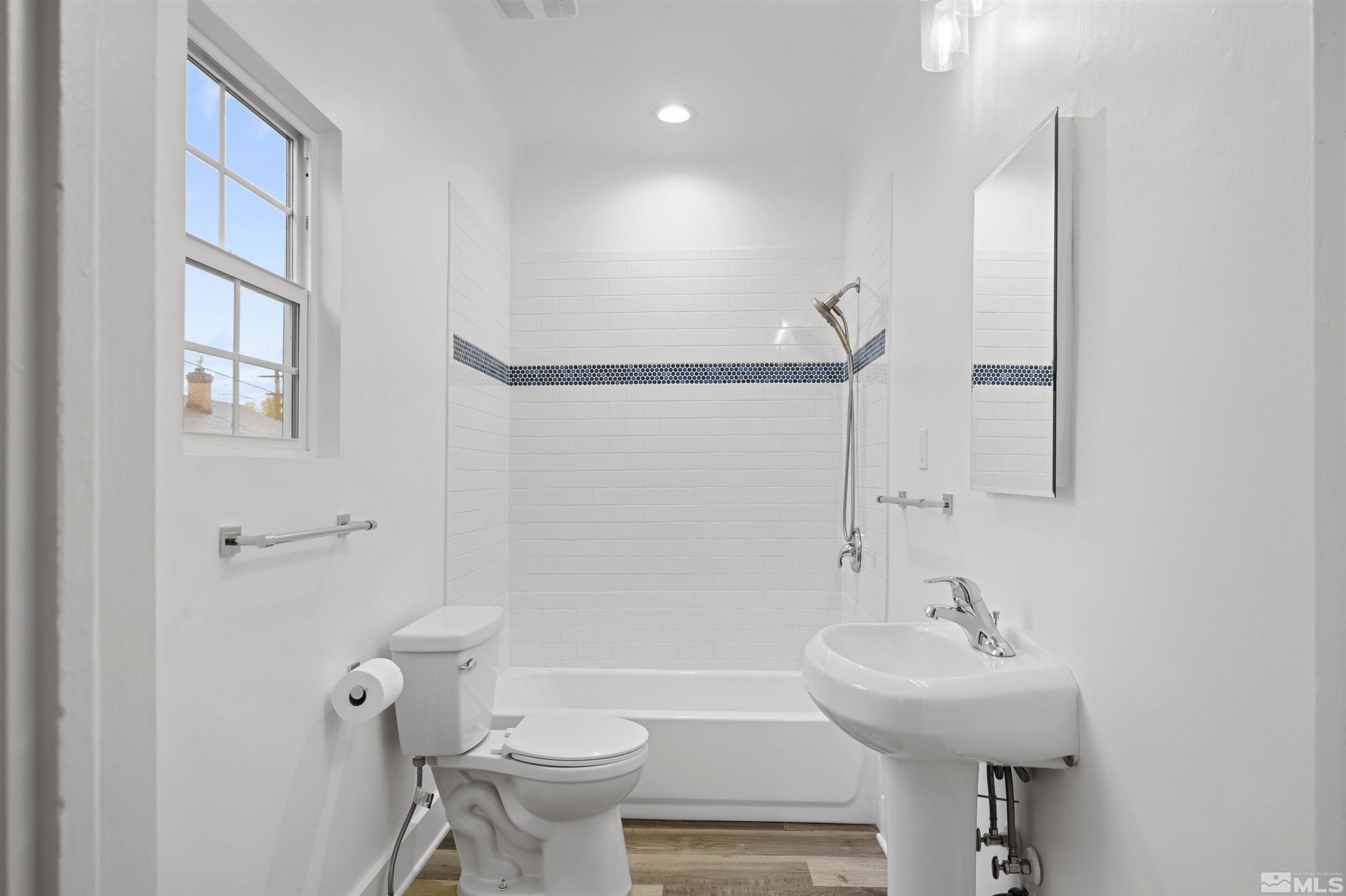 955 Watt Reno, NV 89509 - Photo 16 of 25 a bathroom with a sink toilet and a mirror