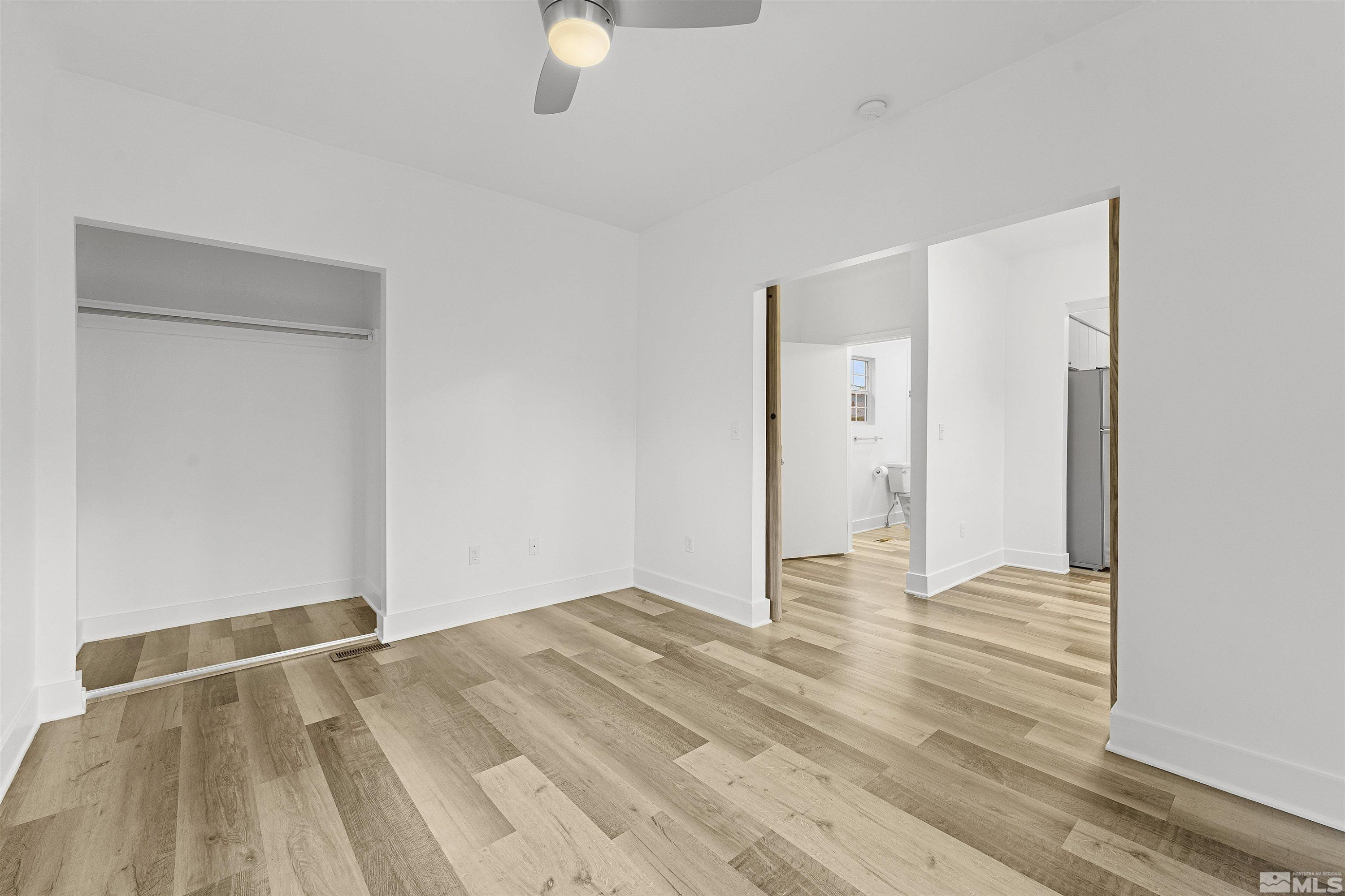 955 Watt Reno, NV 89509 - Photo 7 of 25 a view of an empty room with wooden floor and a window