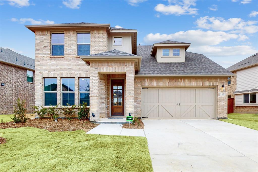 1420 Prairie Clover Road Prosper, TX 75078 - Photo 1 of 1 a front view of a house with garden