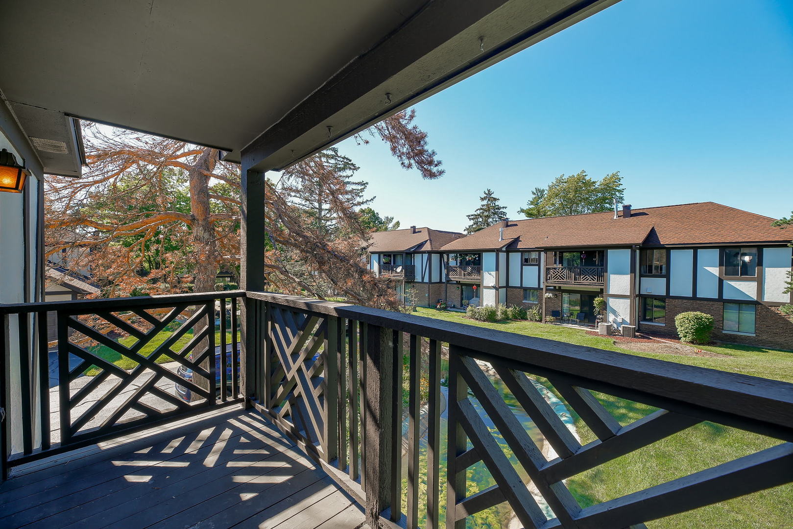 865 Sheldon Court, Unit C Wheaton, IL 60189 - Photo 9 of 17 a view of a balcony with two chairs and a table