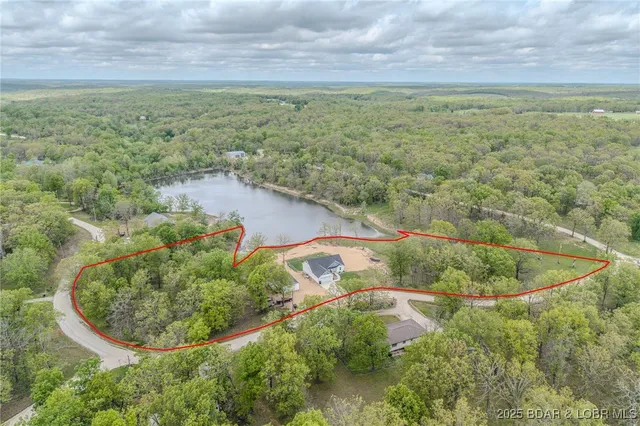$549,900 | 735 Lake Of The Woods Drive, Macks Creek, MO 65786