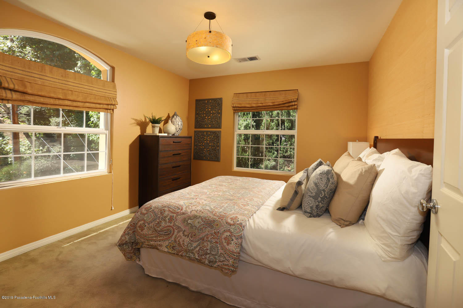 1934 Pasadena Glen Road Pasadena, CA 91107 - Photo 13 of 26 a bedroom with a bed and a window