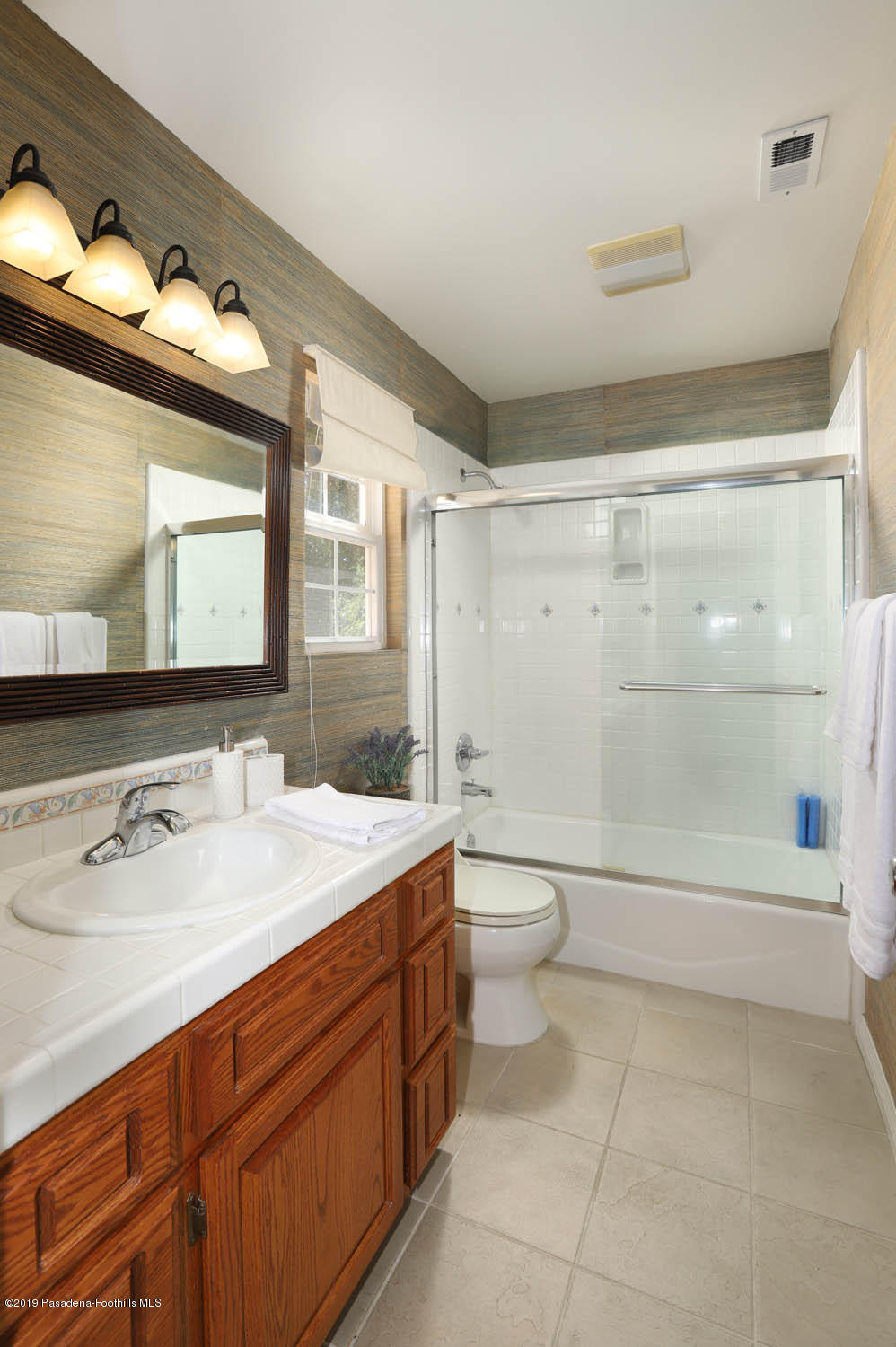 1934 Pasadena Glen Road Pasadena, CA 91107 - Photo 15 of 26 a bathroom with a sink a toilet and shower