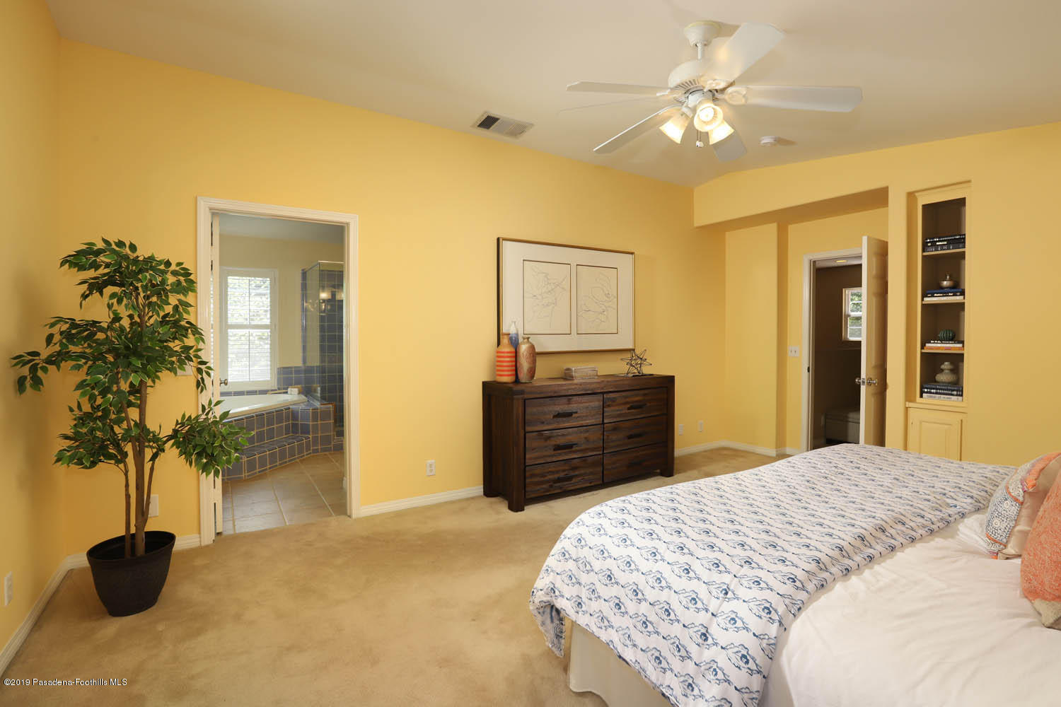 1934 Pasadena Glen Road Pasadena, CA 91107 - Photo 16 of 26 a bedroom with a bed and a chandelier