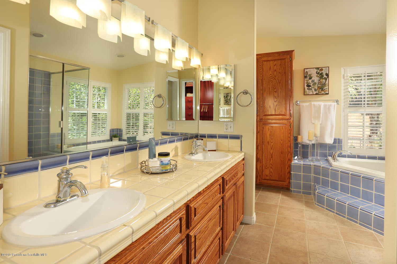 1934 Pasadena Glen Road Pasadena, CA 91107 - Photo 18 of 26 a bathroom with a granite countertop sink and a mirror