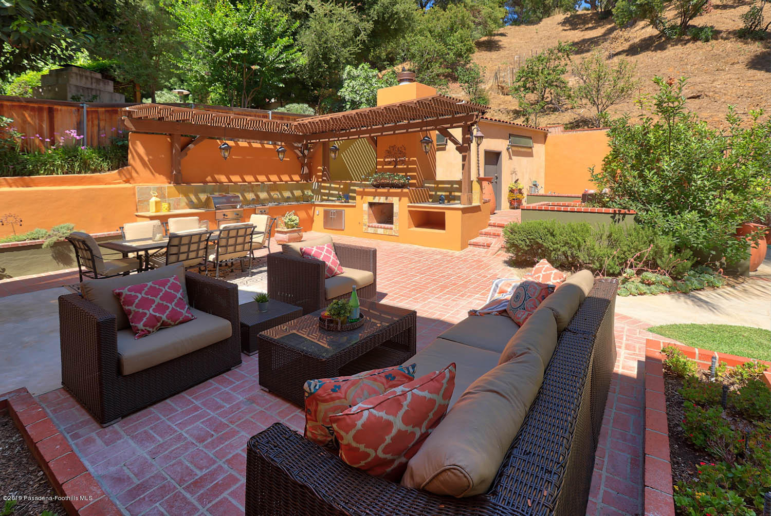 1934 Pasadena Glen Road Pasadena, CA 91107 - Photo 21 of 26 a view of a patio with couches chairs and a floor to ceiling window next to a yard