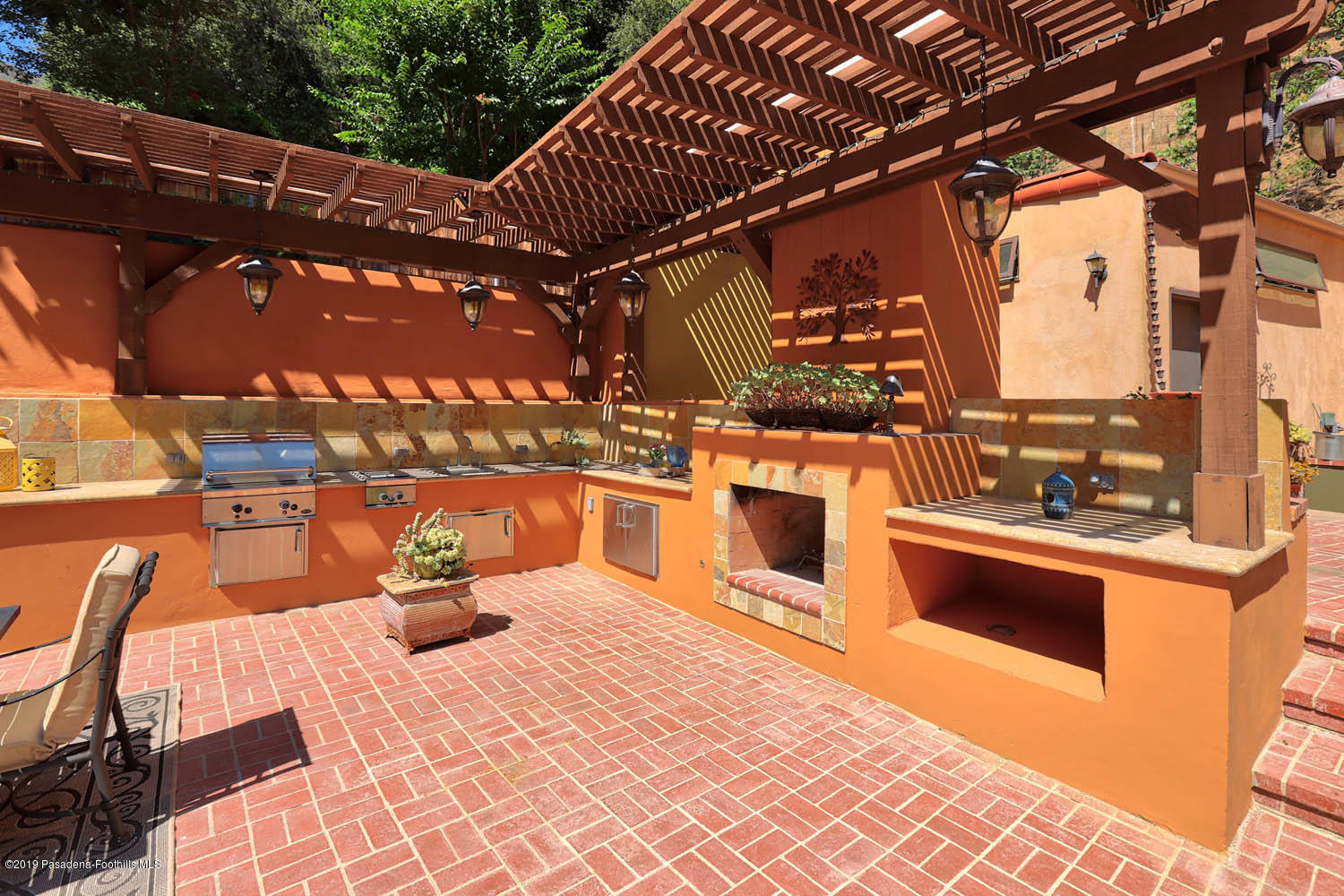 1934 Pasadena Glen Road Pasadena, CA 91107 - Photo 22 of 26 a kitchen with stainless steel appliances granite countertop a stove and a sink