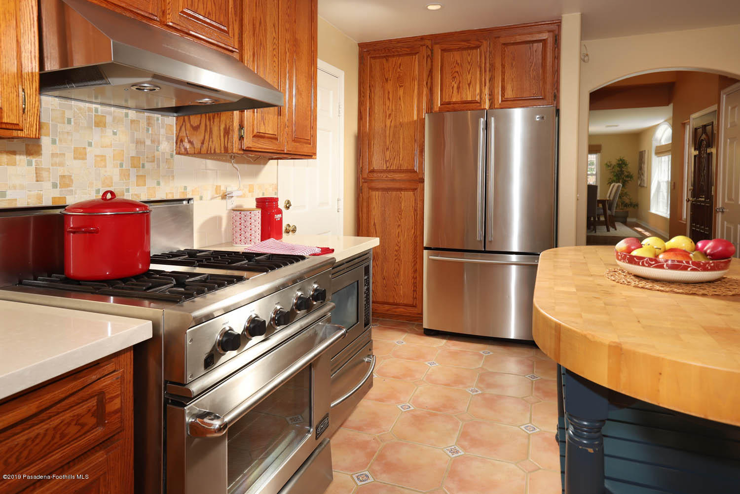 1934 Pasadena Glen Road Pasadena, CA 91107 - Photo 7 of 26 a kitchen with a stove and a refrigerator