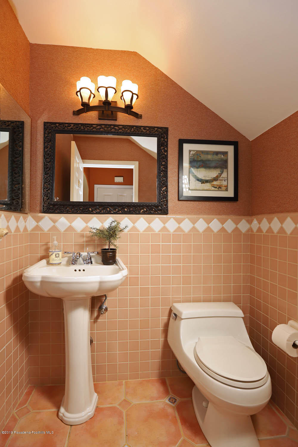 1934 Pasadena Glen Road Pasadena, CA 91107 - Photo 9 of 26 a bathroom with a toilet sink and mirror