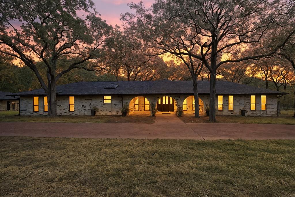 4000 Post Oak Road Flower Mound, TX 75022 - Photo 2 of 40 View of the main house with semi-circular driveway and expansive front lawn