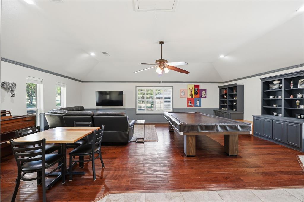 4000 Post Oak Road Flower Mound, TX 75022 - Photo 21 of 40 Main house - Another view of the second living area featuring built in cabinets and shelving
