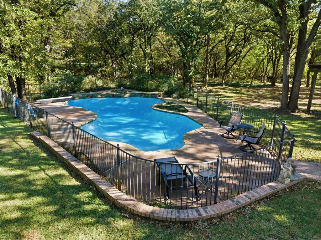 4000 Post Oak Road Flower Mound, TX 75022 - Photo 4 of 40 The well-maintained salt water pool is situated conveniently between both residences for easy access.