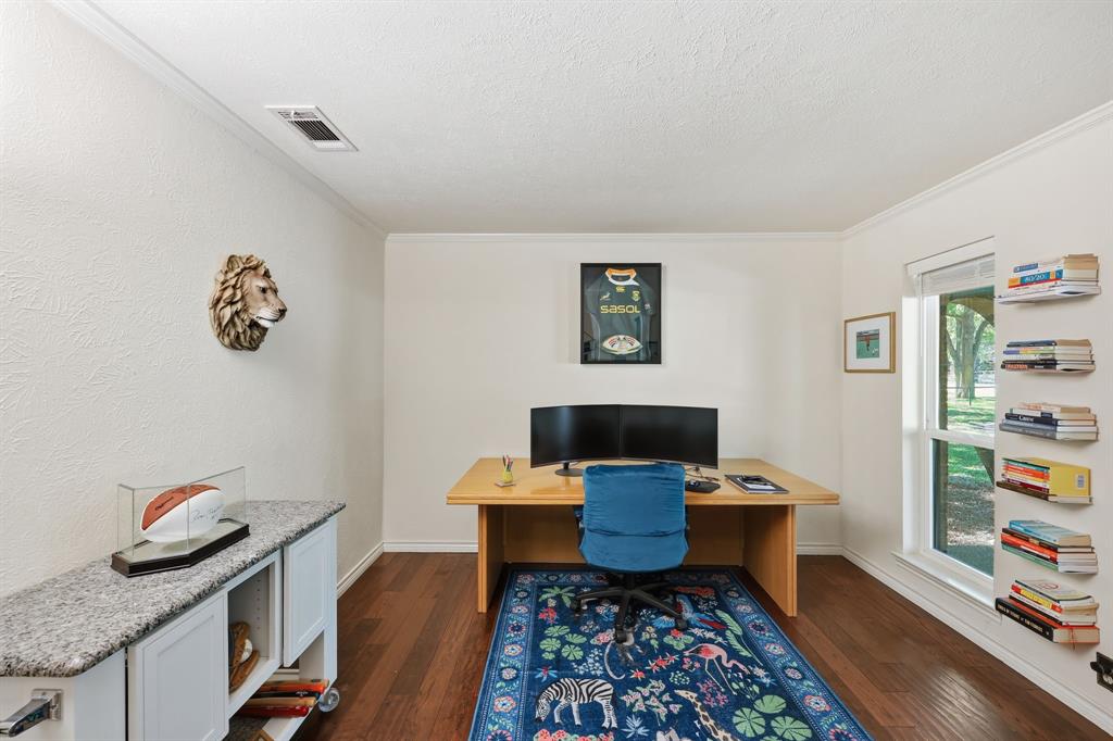 4000 Post Oak Road Flower Mound, TX 75022 - Photo 6 of 40 Main house - Office with dark wood flooring, ornamental molding, and arched entryway