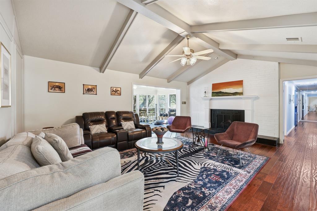 4000 Post Oak Road Flower Mound, TX 75022 - Photo 8 of 40 Main house - Relax in the living room in front of the fire as you enjoy the natural light beaming off the sunroom