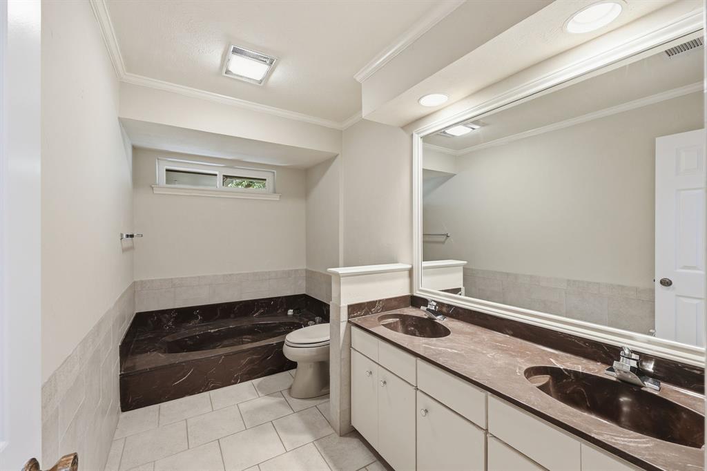 4000 Post Oak Road Flower Mound, TX 75022 - Photo 10 of 40 Main house - Full bathroom with dual sinks. Flooring that matches the primary bathroom will be left for new owners to install