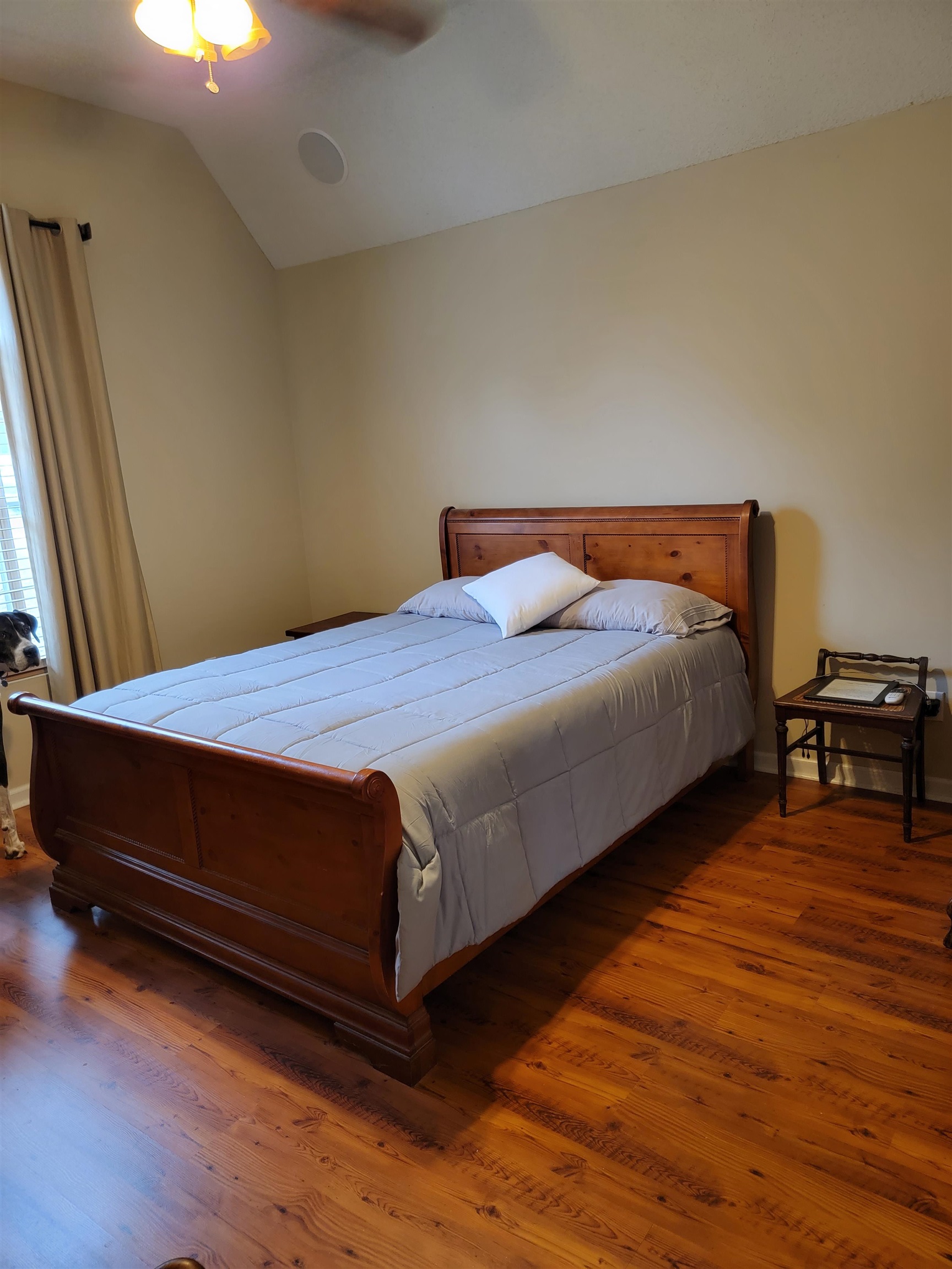 7926 Macon Road Cordova, TN 38018 - Photo 12 of 15 Bedroom with lofted ceiling, wood finished floors, and a ceiling fan