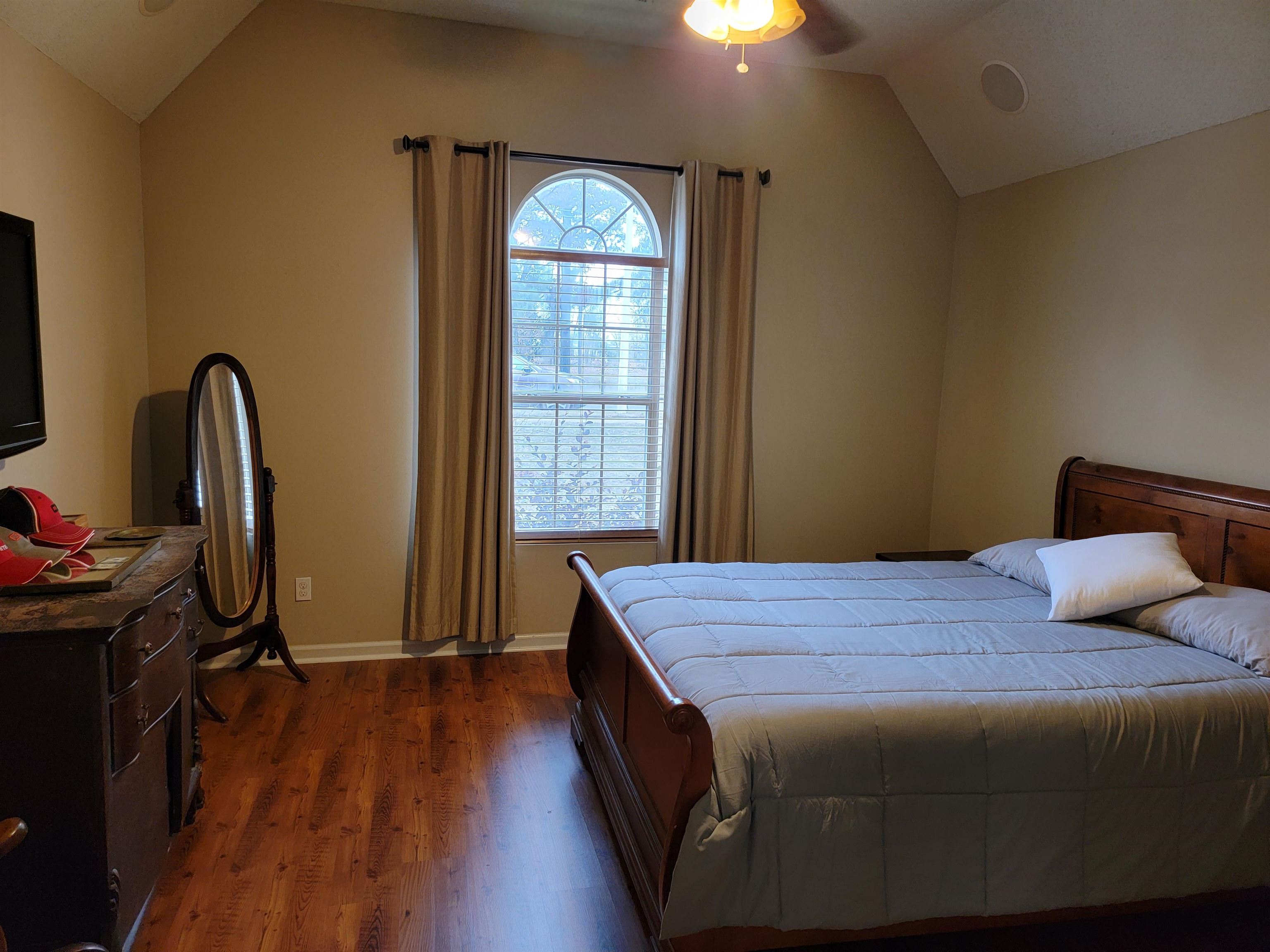 7926 Macon Road Cordova, TN 38018 - Photo 13 of 15 Bedroom featuring lofted ceiling, dark wood-type flooring, and ceiling fan