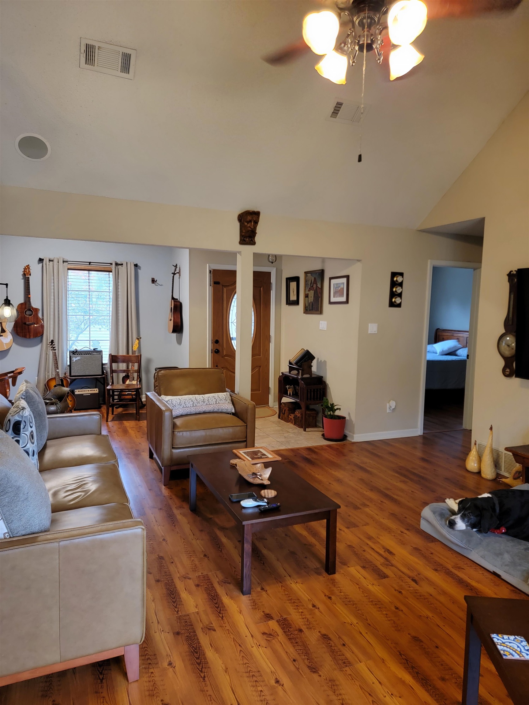 7926 Macon Road Cordova, TN 38018 - Photo 2 of 15 Living area featuring lofted ceiling, wood finished floors, and ceiling fan