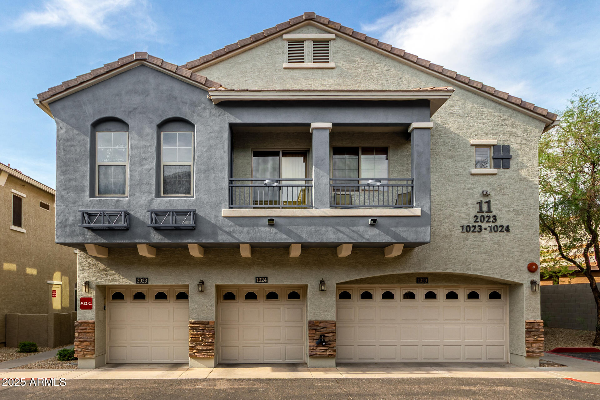 2150 West Alameda Road, Unit 1024 Phoenix, AZ 85085 - Photo 1 of 24 a front view of a building with parking area