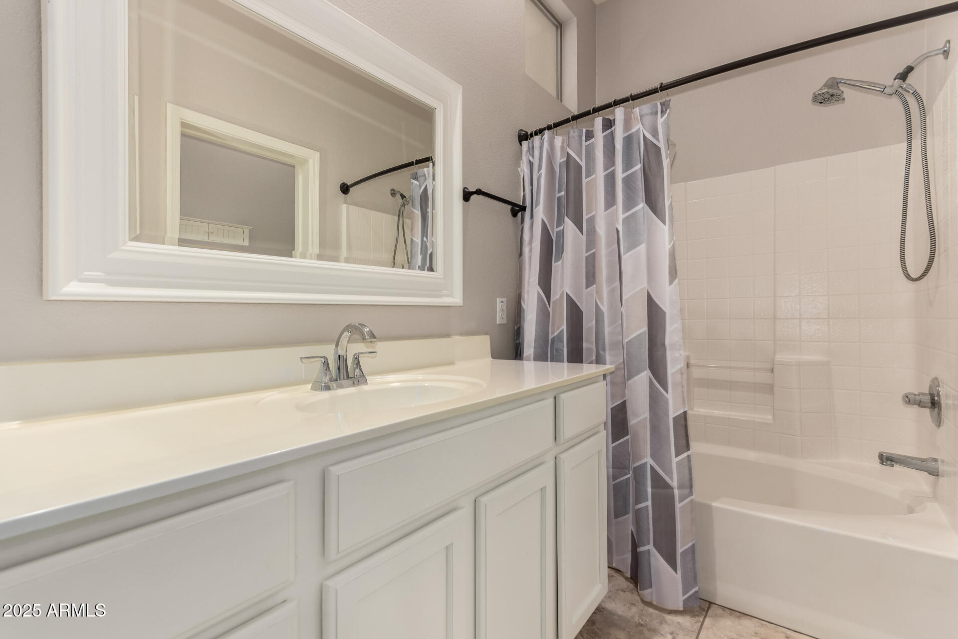 2150 West Alameda Road, Unit 1024 Phoenix, AZ 85085 - Photo 13 of 24 a bathroom with a sink a mirror a shower and a bathtub