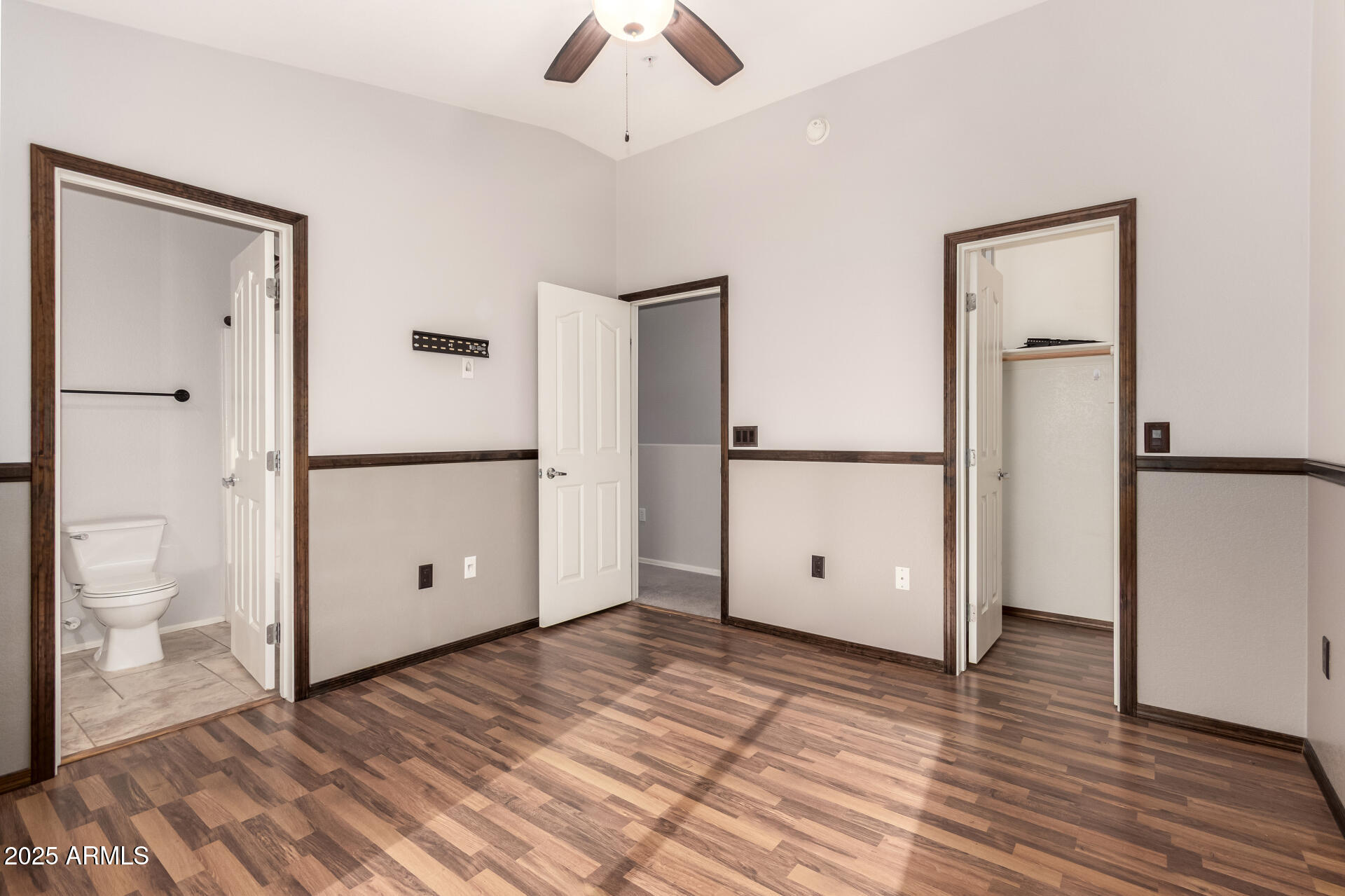 2150 West Alameda Road, Unit 1024 Phoenix, AZ 85085 - Photo 14 of 24 a view of a room with wooden floor and a ceiling fan