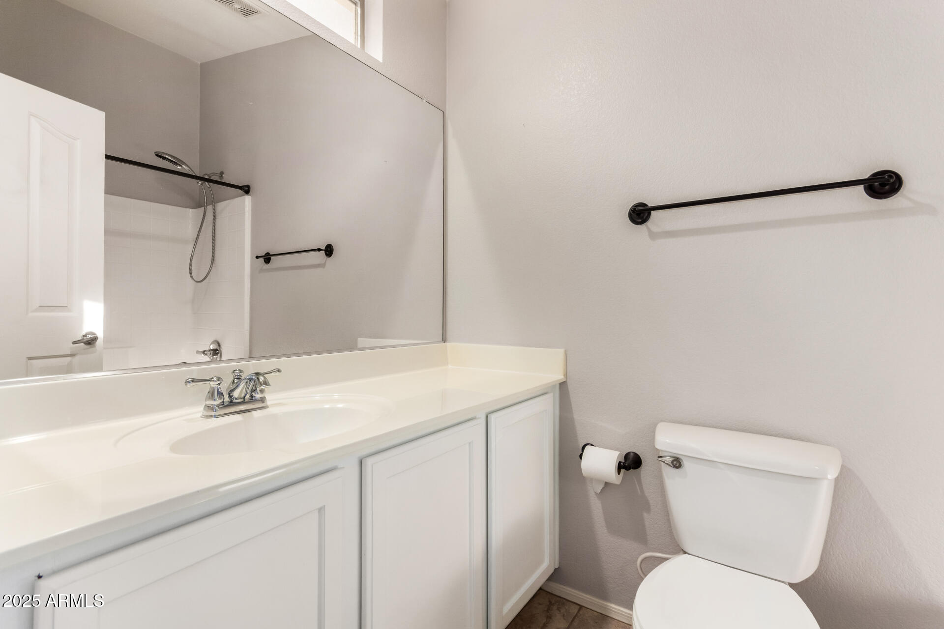 2150 West Alameda Road, Unit 1024 Phoenix, AZ 85085 - Photo 15 of 24 a bathroom with a sink toilet and a mirror