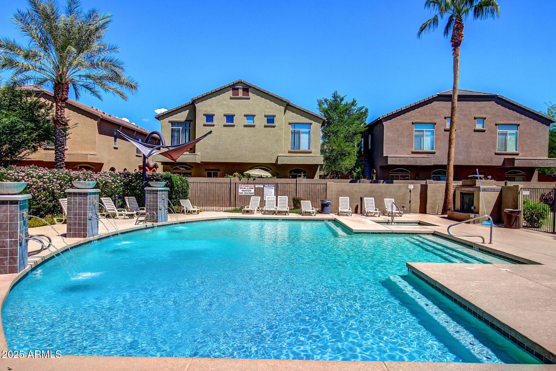 2150 West Alameda Road, Unit 1024 Phoenix, AZ 85085 - Photo 20 of 24 a front view of a house with garden