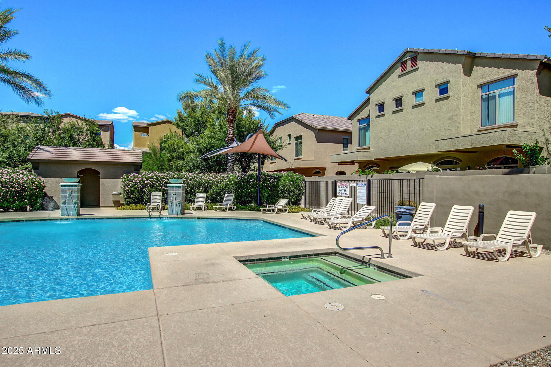 2150 West Alameda Road, Unit 1024 Phoenix, AZ 85085 - Photo 21 of 24 a front view of a house with garden and sitting area