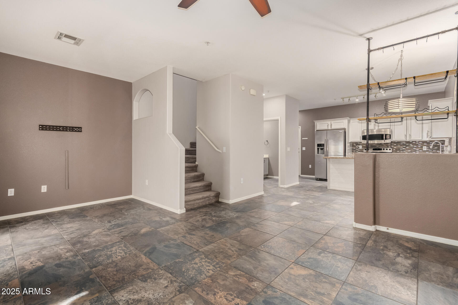 2150 West Alameda Road, Unit 1024 Phoenix, AZ 85085 - Photo 7 of 24 a view of a kitchen with refrigerator and wooden floor