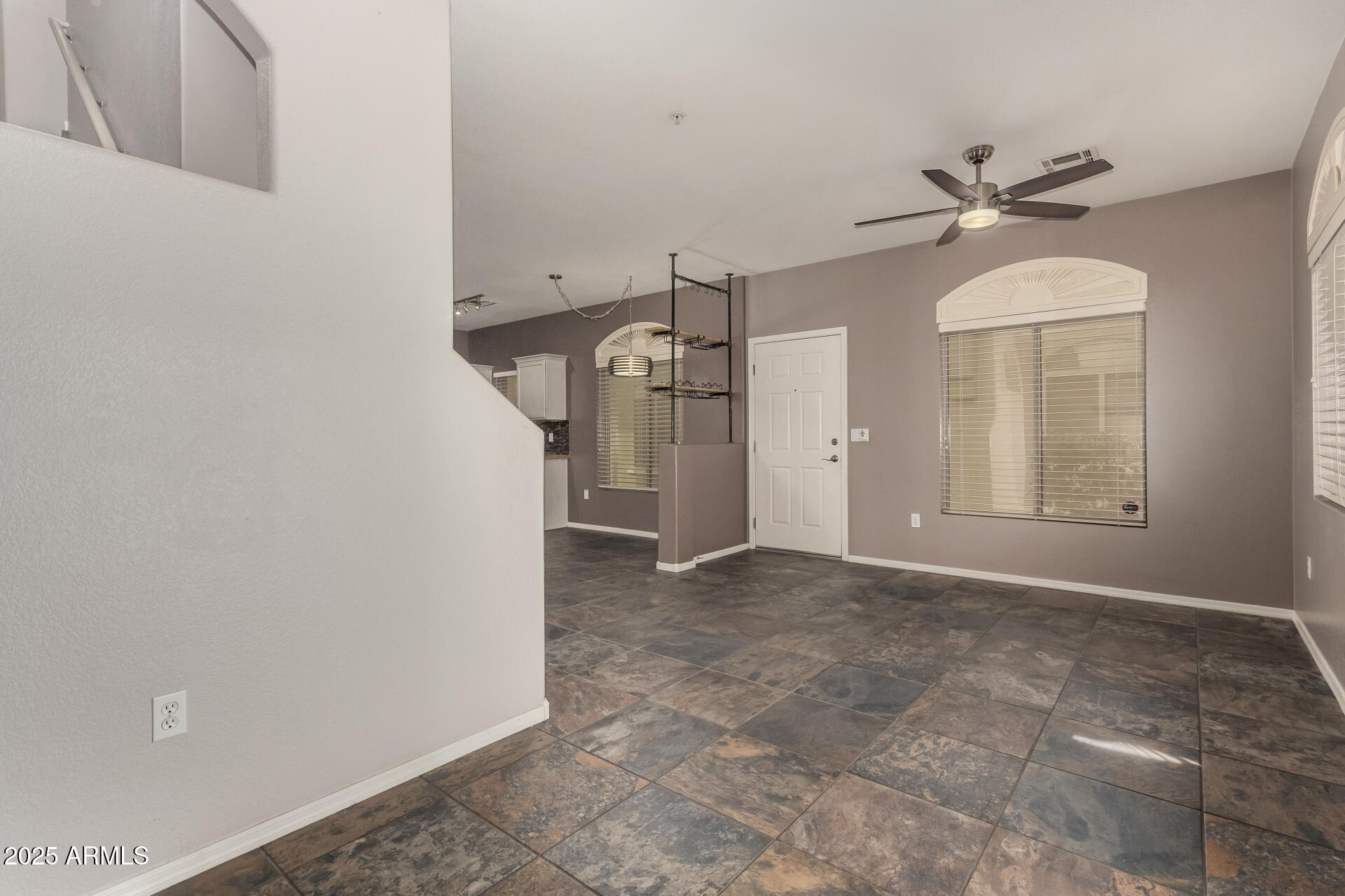 2150 West Alameda Road, Unit 1024 Phoenix, AZ 85085 - Photo 8 of 24 en view interior of a house with a ceiling fan and window