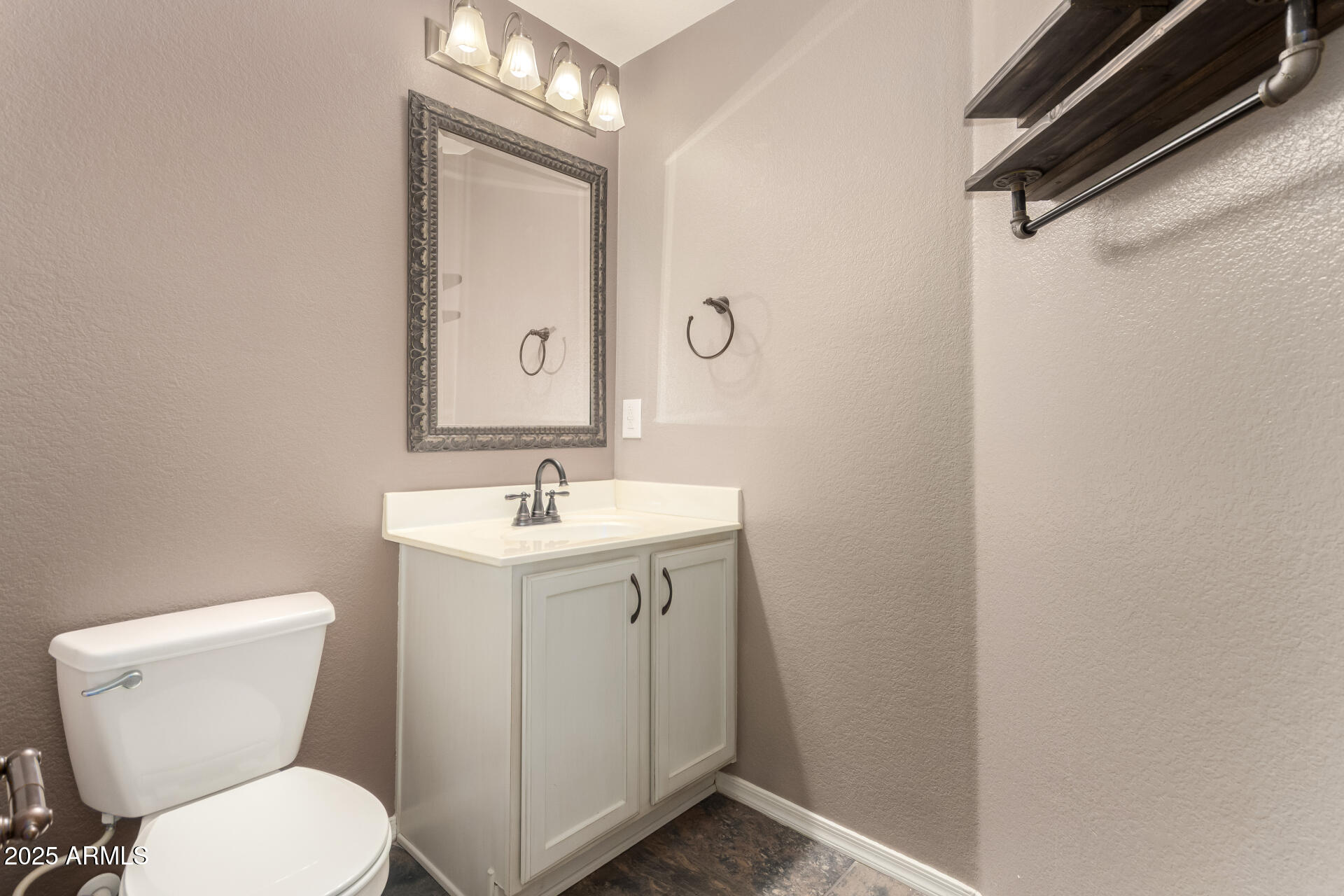 2150 West Alameda Road, Unit 1024 Phoenix, AZ 85085 - Photo 10 of 24 a bathroom with a toilet sink and mirror