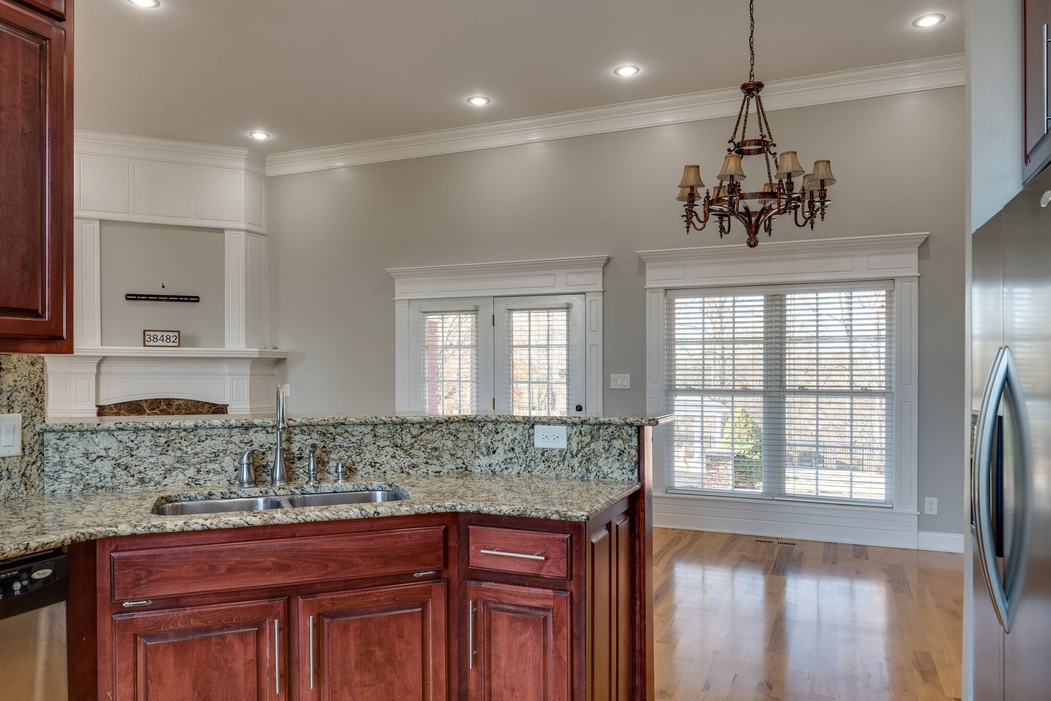 5052 Fields Hollow Road Santa Fe, TN 38482 - Photo 22 of 50 a kitchen with kitchen island granite countertop a sink and dishwasher with wooden floor