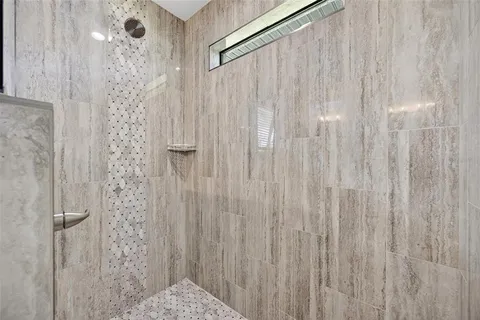 a bathroom with a shower curtain and a shower curtain