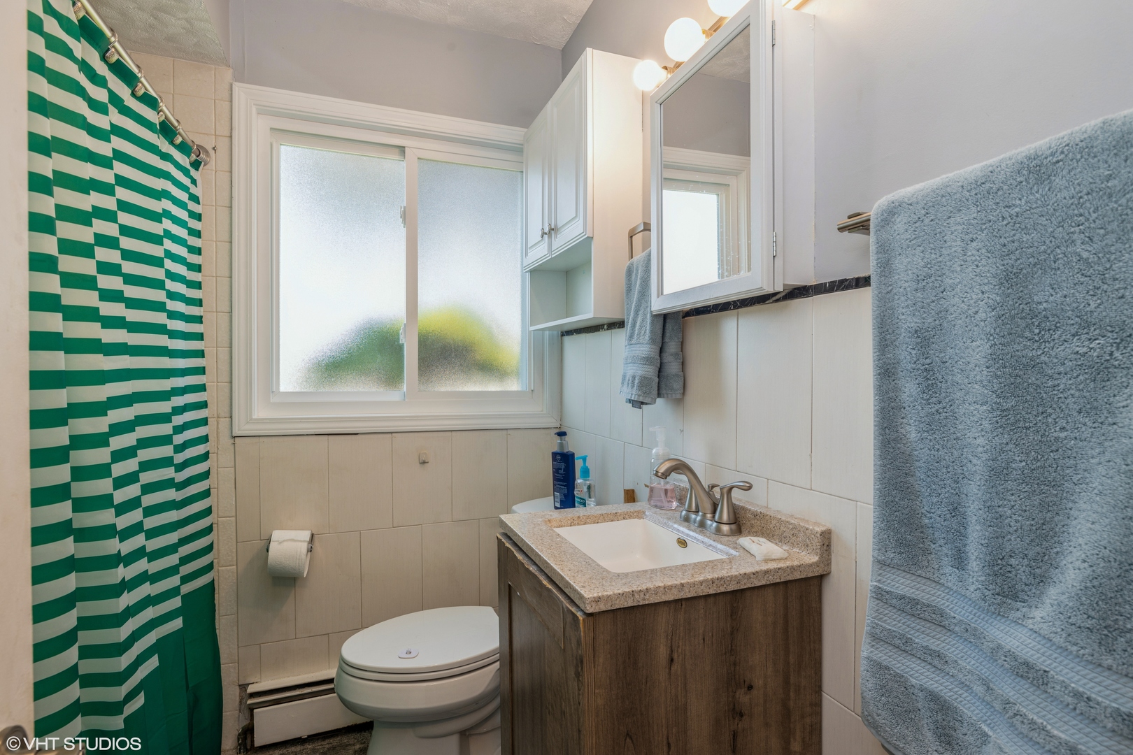 8705 45th Street Lyons, IL 60534 - Photo 15 of 19 a bathroom with a sink and a toilet