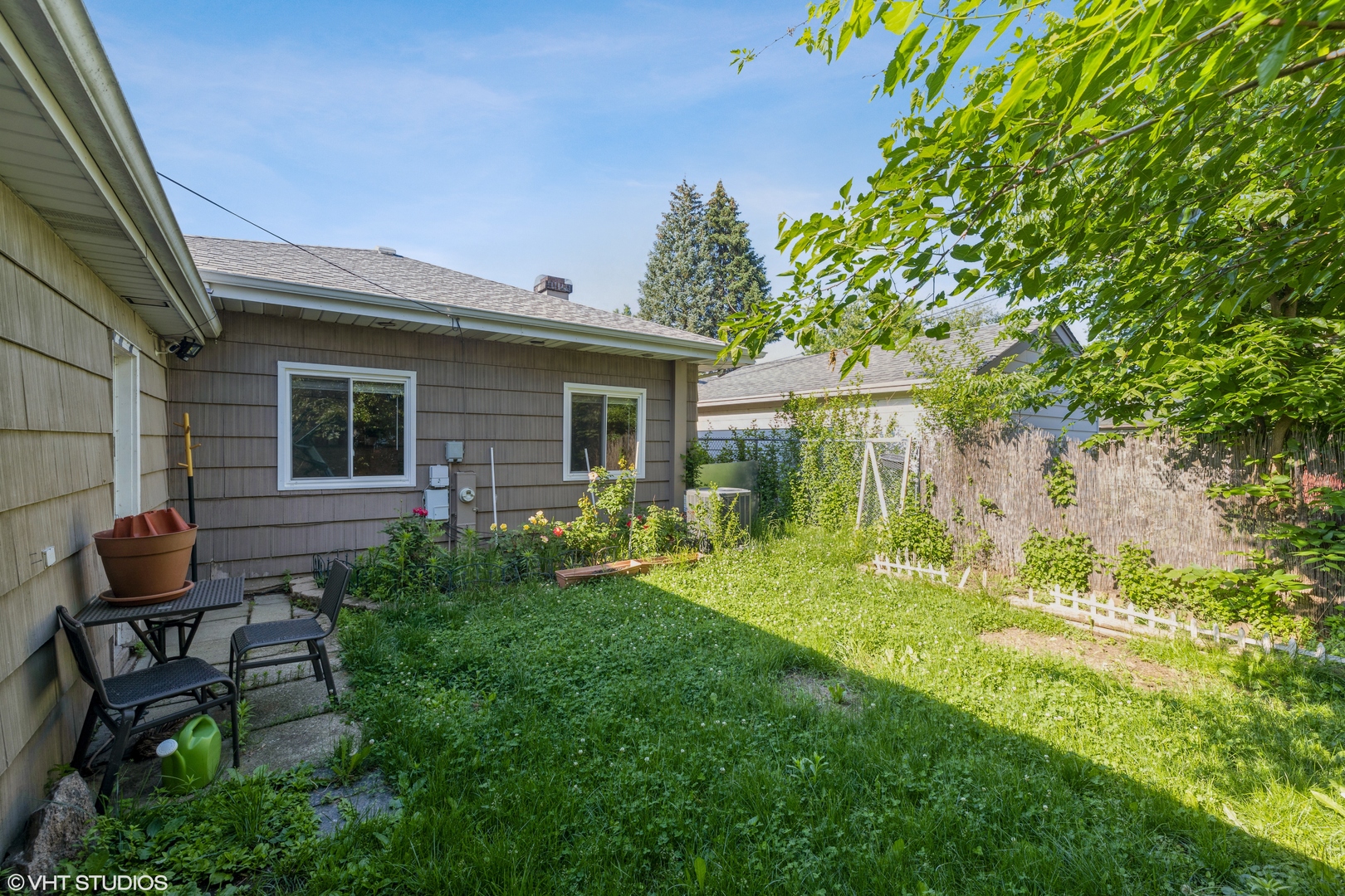 8705 45th Street Lyons, IL 60534 - Photo 18 of 19 a backyard of a house with table and chairs
