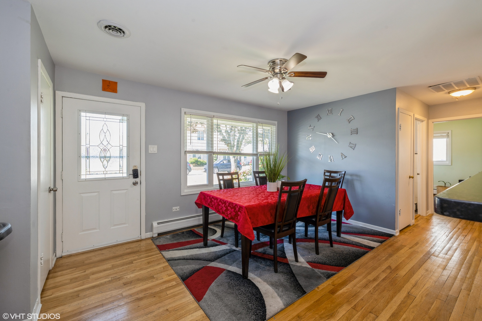 8705 45th Street Lyons, IL 60534 - Photo 3 of 19 a view of a dining room with furniture window and wooden floor