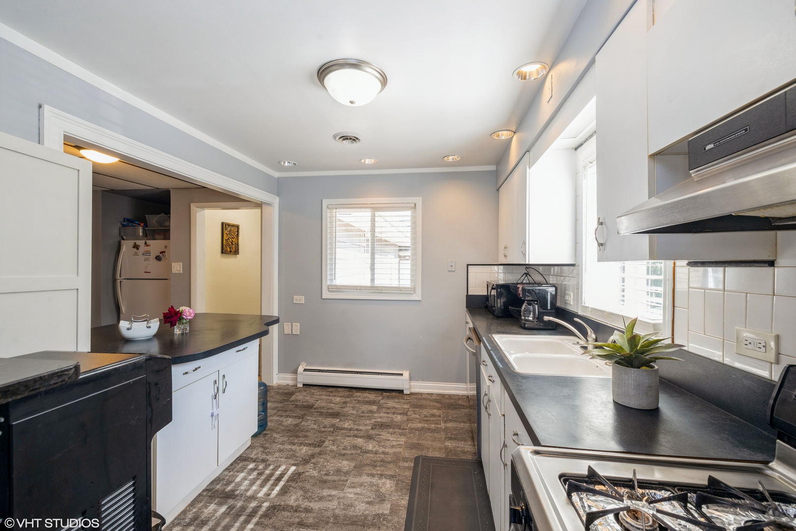 8705 45th Street Lyons, IL 60534 - Photo 6 of 19 a kitchen with stainless steel appliances granite countertop a sink stove and cabinets