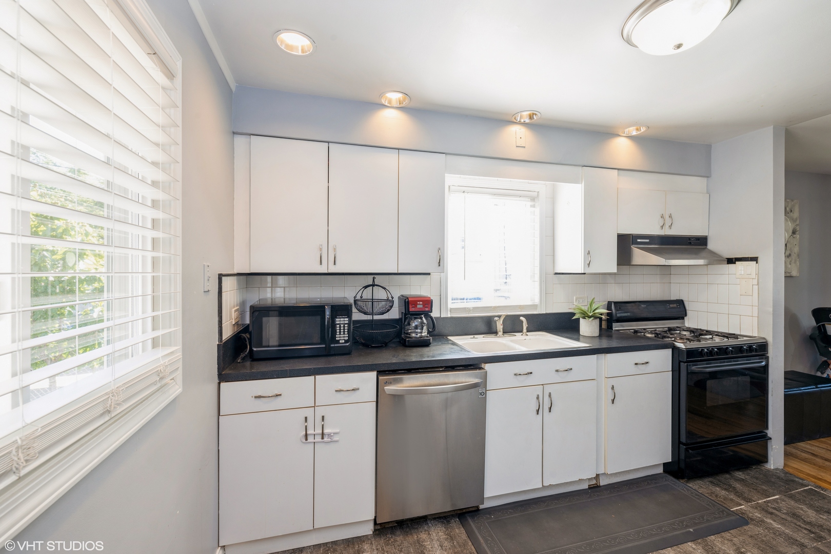 8705 45th Street Lyons, IL 60534 - Photo 8 of 19 a kitchen with appliances a sink and cabinets