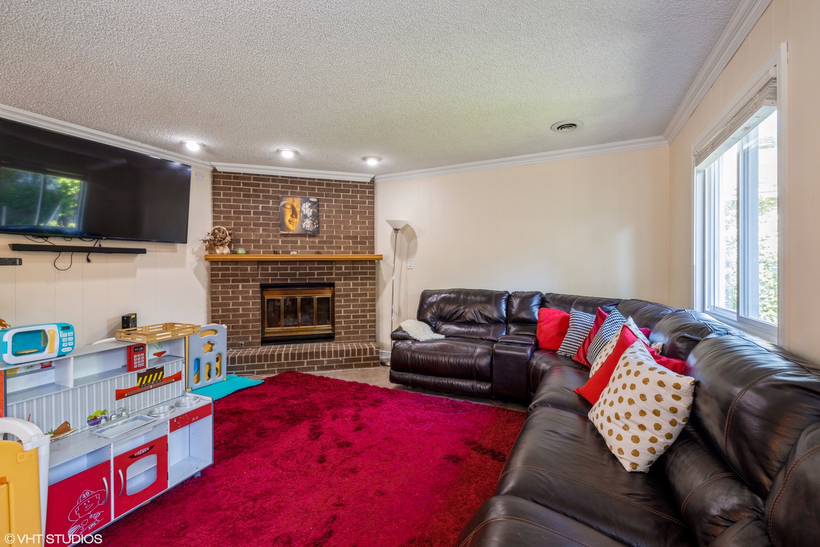 8705 45th Street Lyons, IL 60534 - Photo 10 of 19 a living room with furniture and a flat screen tv
