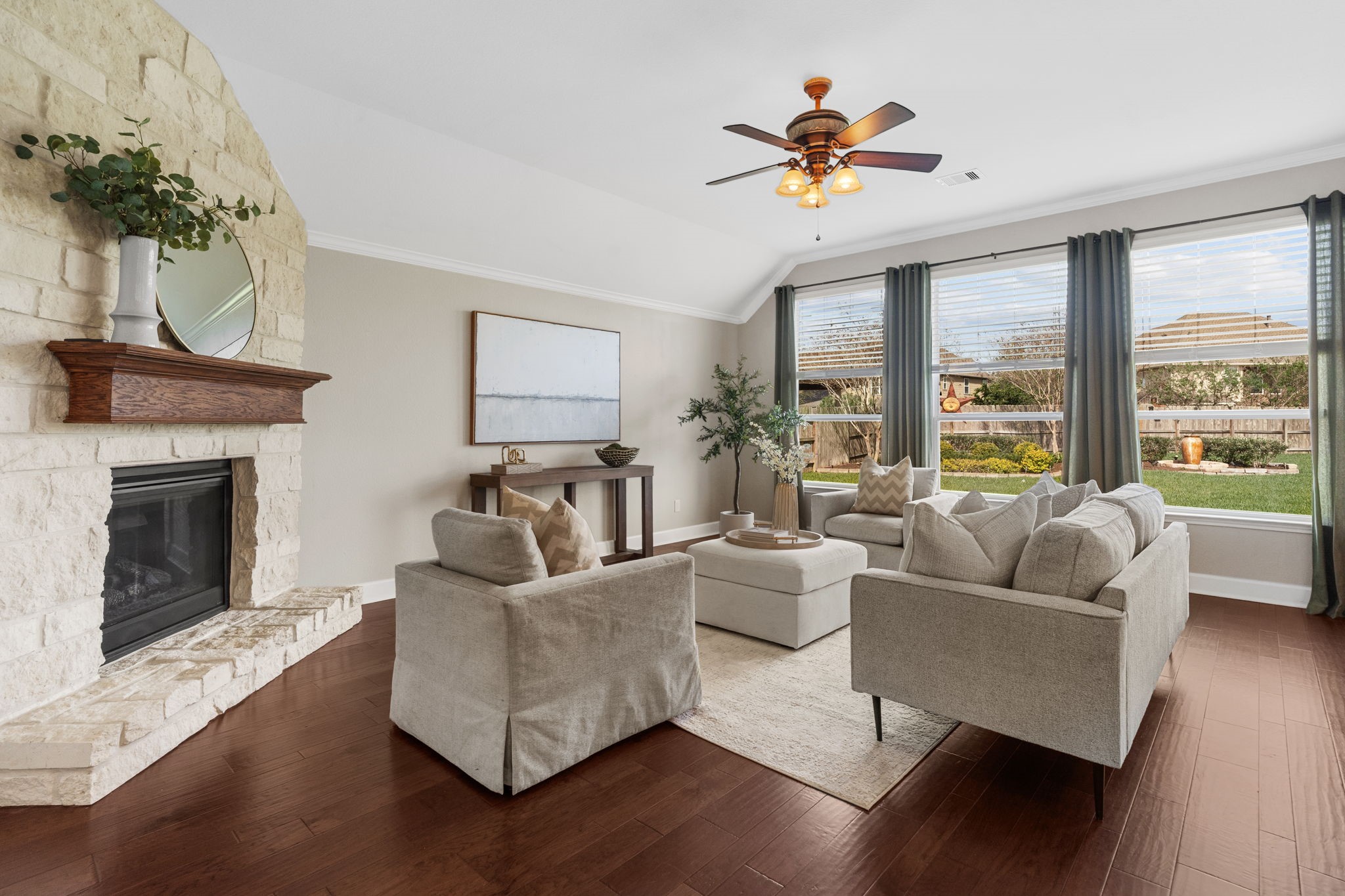 3426 Summer Ranch Drive Katy, TX 77494 - Photo 10 of 48 The family room is filled with natural light and anchored by a charming fireplace, offering a cozy atmosphere for relaxing evenings and gathering with loved ones.