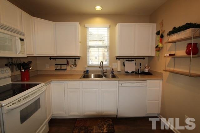 9914 Reanne Court Raleigh, NC 27617 - Photo 12 of 25 a kitchen with a sink cabinets and window