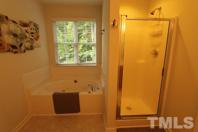 9914 Reanne Court Raleigh, NC 27617 - Photo 15 of 25 a bathroom with a shower