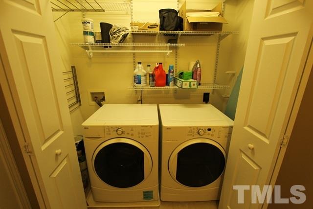9914 Reanne Court Raleigh, NC 27617 - Photo 22 of 25 a utility room with dryer and washer