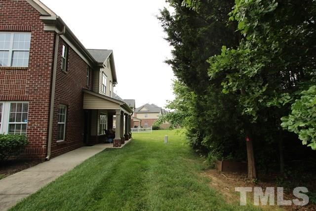 9914 Reanne Court Raleigh, NC 27617 - Photo 25 of 25 a view of a house with a yard and a tree