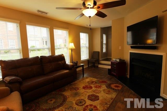 9914 Reanne Court Raleigh, NC 27617 - Photo 4 of 25 a living room with furniture and a flat screen tv