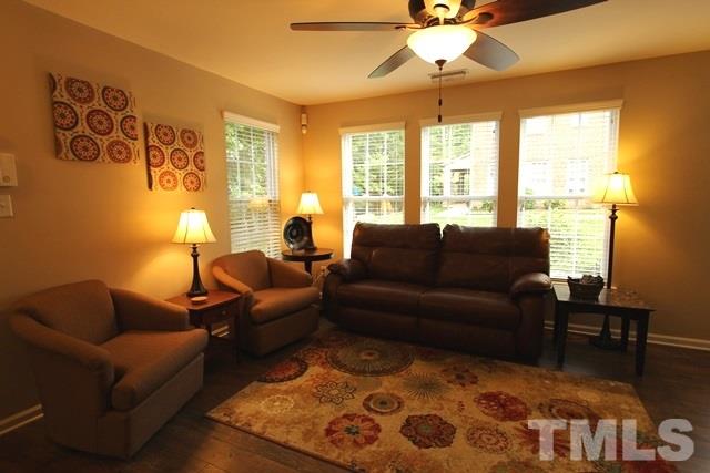9914 Reanne Court Raleigh, NC 27617 - Photo 7 of 25 a living room with furniture and a large window