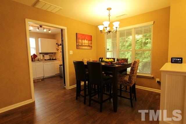 9914 Reanne Court Raleigh, NC 27617 - Photo 9 of 25 a view of a dining room with furniture and window