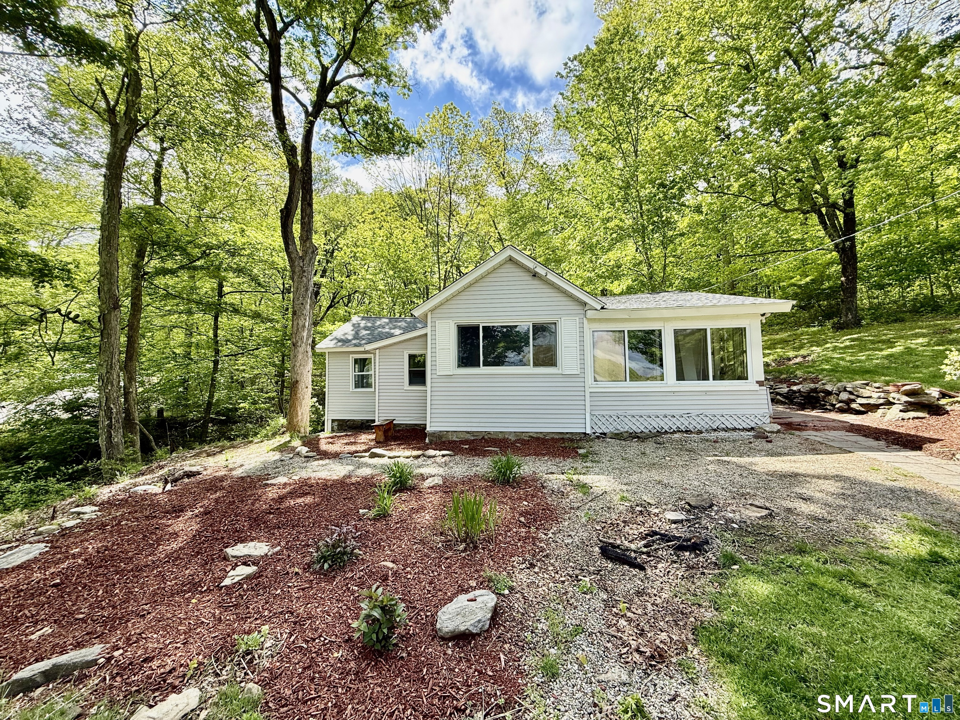 277 Lake Road Andover, CT 06232 - Photo 1 of 18 a view of a house with a yard