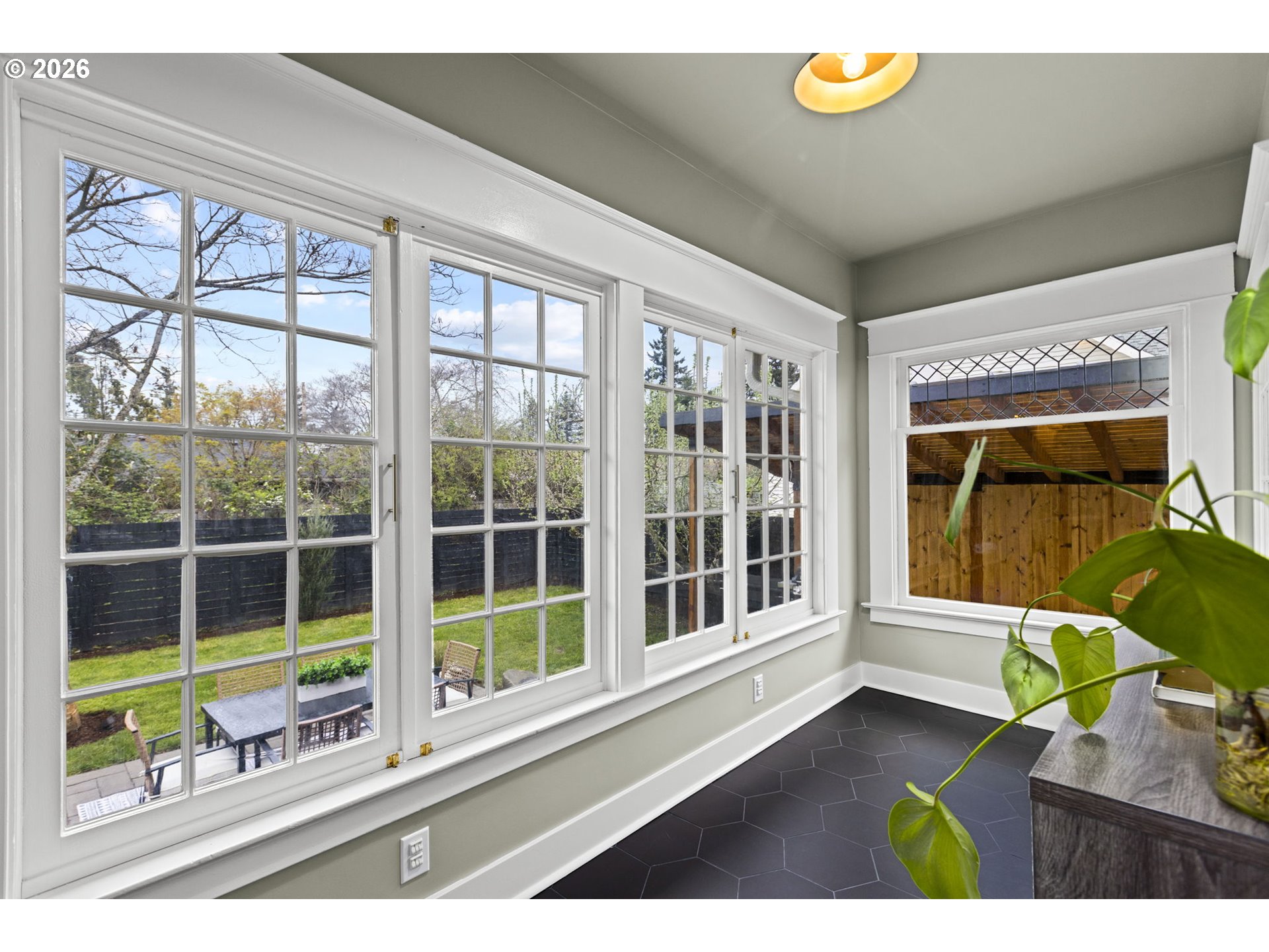 7123 Southeast Rhone Street Portland, OR 97206 - Photo 19 of 48 a view of a house with a large window