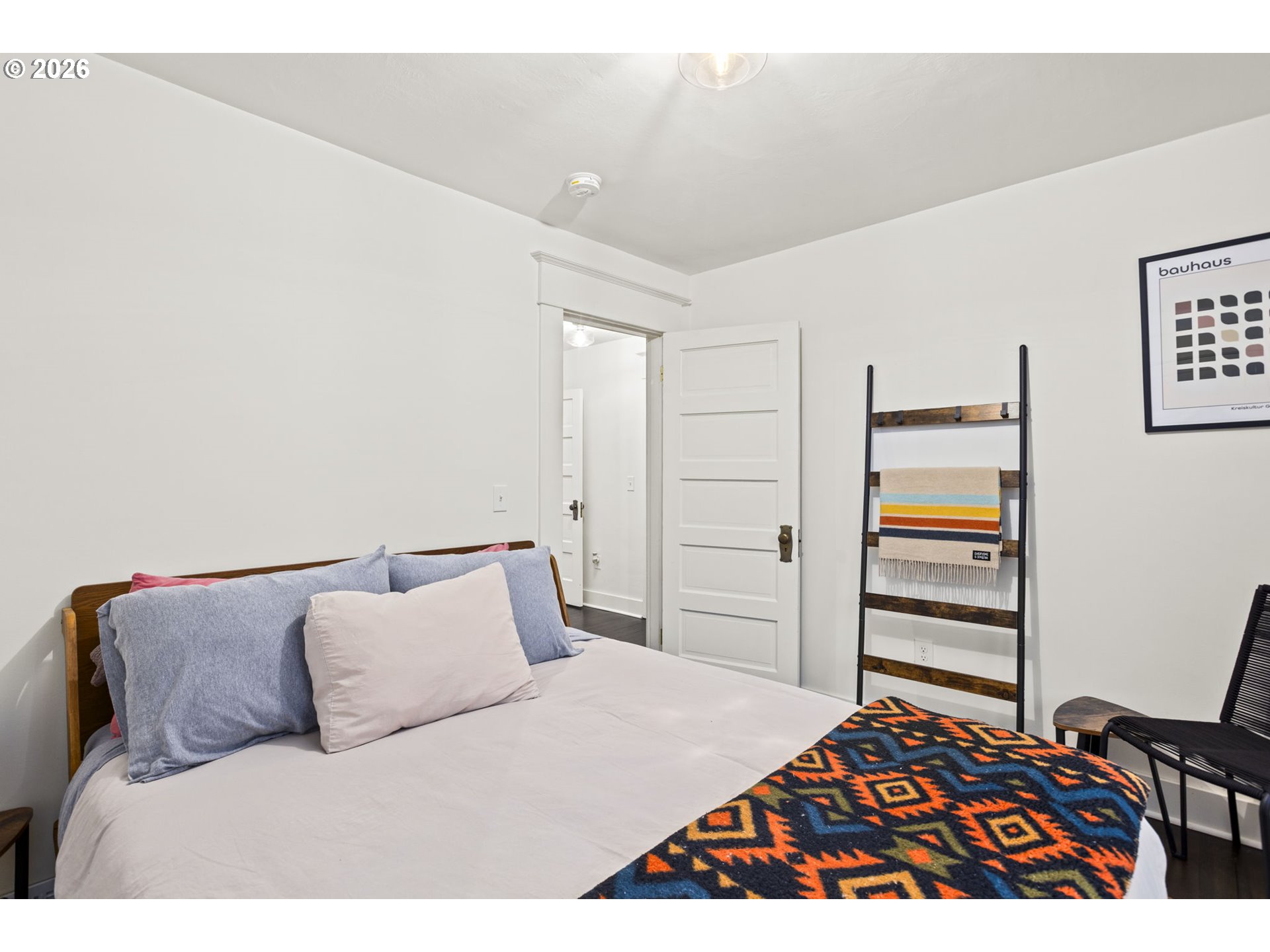 7123 Southeast Rhone Street Portland, OR 97206 - Photo 28 of 48 a bedroom with a bed and dresser